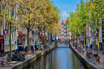 Amsterdam street with canal with old houses © Dmitry Rukhlenko