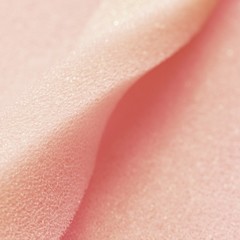 White pink artificial foam, soft texture on a light background.