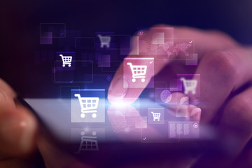 Finger touching phone with online shopping concept and dark background