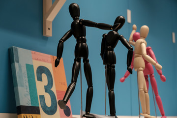 A wooden articulated mannequins,different colors