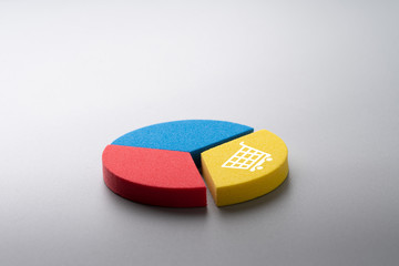 Online shopping icon on colorful pie chart puzzle