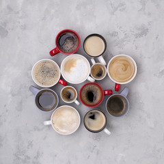 Various coffee in different cups on the concrete gray background