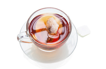 A cup of fresh tea steeping with a teabag