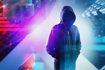 Hacker in hoodie in blurry city