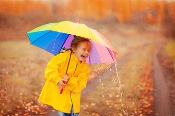 Happy girl with rainbow umbrella in autumn park © Stanislaw Mikulski