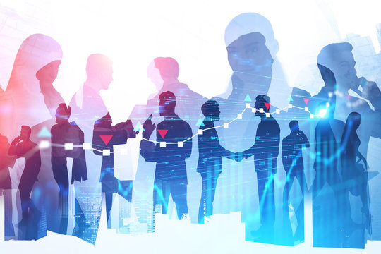 Silhouettes of business partners, digital charts