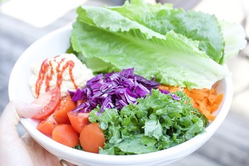 healthy Food, Salad cup with hummus, lettuce, tomato, red cabbage