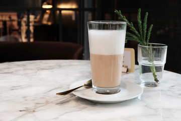 A glass of hot coffee with milk  latte local coffee shop