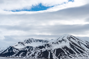 Beautiful snow covered mountain landscape in Svalbard, Norway.