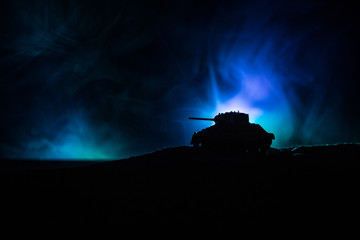 War Concept. Military silhouettes fighting scene on war fog sky background, Silhouette of armored...