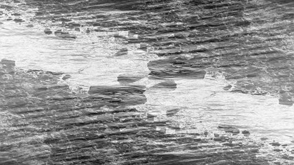 Obraz premium An abstract black and white grunge background image.