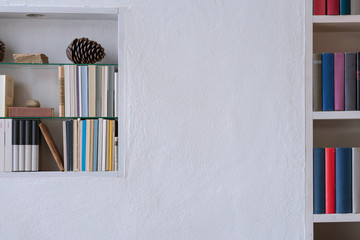 Indoor white wall with bookshelf and copyspace © stock mp
