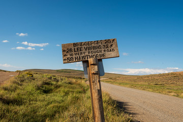 wood road sign hand carved lettering rural California USA