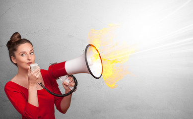 Person with megaphone and colorful splashes