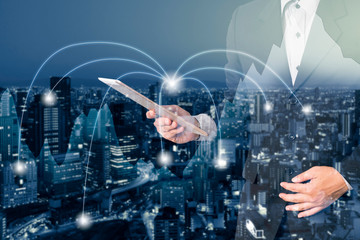 Double exposure businessman in trading business graph and city connection network background