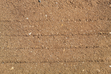 Wheel Trails in Sandy Soil Ground