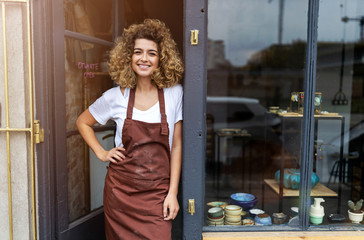 Portrait of woman pottery artist in art studio