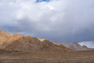 Naklejka na ściany i meble Shockingly desolate Moonland landscape at Lamayuru, in Ladakh, IndiaThe northern Indian Himalayan Region (IHR) mountain is the section of the Himalayas