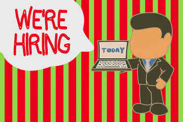 Writing note showing We Are Re Hiring. Business concept for process of reviewing applications and finding candidates Standing professional businessman holding open laptop right hand side