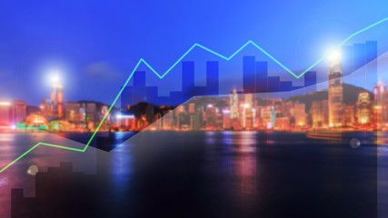 Double exposure business trading graph on blur city night background