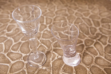 empty glass sharp stone background 