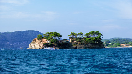 Zakynthos Island, Greece - September 11, 2019: Cameo Island is available through a picturesque wood...