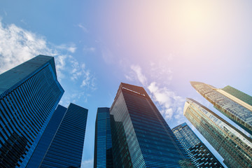 Obraz na płótnie Canvas High financial building on blue sky. vintage filter
