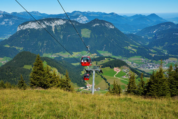 Beautiful landscape with austrian alps mountains and gondola cable lift transportation in Soll,...