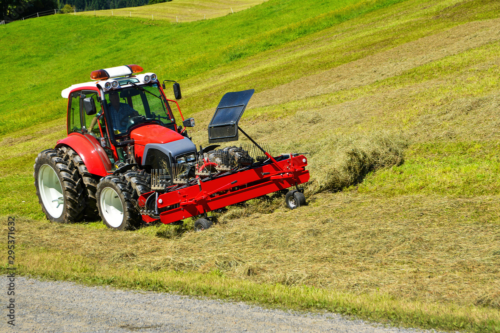 Wall mural Tractor in the field , Hohe Salve mountain, Soll, Austrian Alps