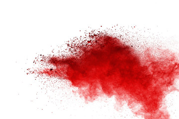 Red powder explosion on white background. Colored cloud. Colorful dust explode. Paint Holi.