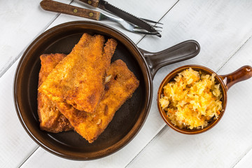 Pieces of cod in breadcrumbs.