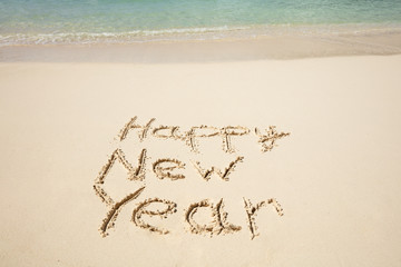 Happy New Year Text Written At Beach