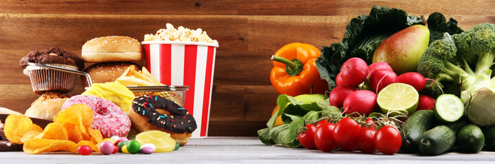 healthy or unhealthy food. Concept photo of healthy and unhealthy food. Fruits and vegetables vs...