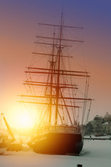 View of the sail ship in Helsinki Marine on the sunrise. Winter landscape with a sailing ship...