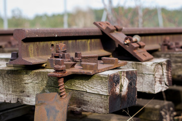 Close up of old abandonnd rusty rails with wooden sleepers i.