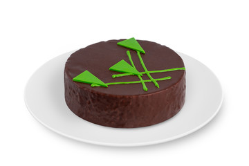 A round biscuit cake with cream lies on a white plate on a white background.