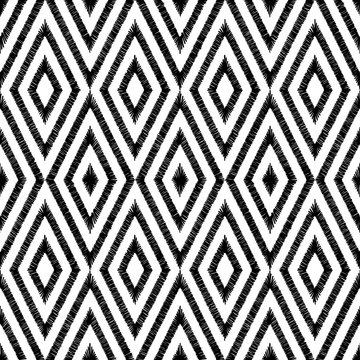 Black and white seamless ikat pattern. The embroidered print for textiles. Geometric ornament. Ethnic and tribal motifs. Vector illustration.