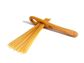 Wooden pasta measuring tool with spaghetti going through, isolated on a white background.