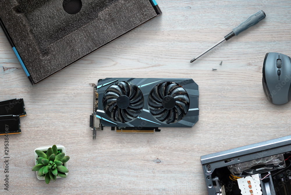 Aufkleber install graphic card in computer case concept. top view scene composition.