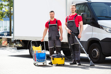 Male Janitors With Cleaning Equipment