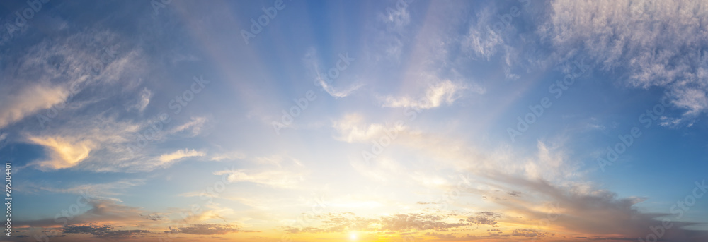 Wall mural sunset cloudy sky with the orange sun