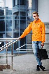 Obraz premium Young man with shopping bags on Black Friday