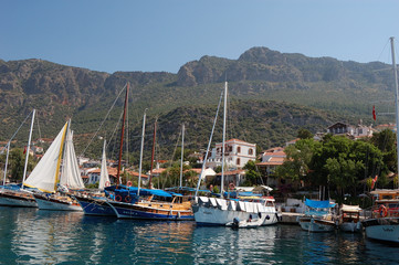 Fototapeta na wymiar The sailboats in the old harbor of Kaş, Turkey