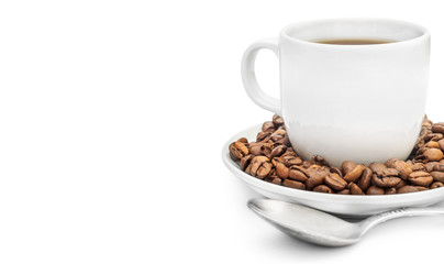 Cup of coffee with coffee beans on saucer and teaspoon on white.