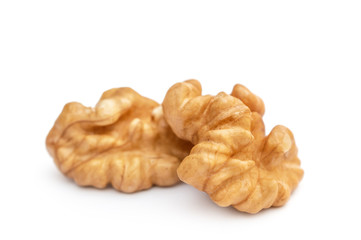 Peeled walnuts on white. Close up.