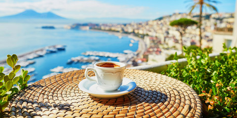 Cup of coffee with view on Vesuvius mount in Naples - obrazy, fototapety, plakaty