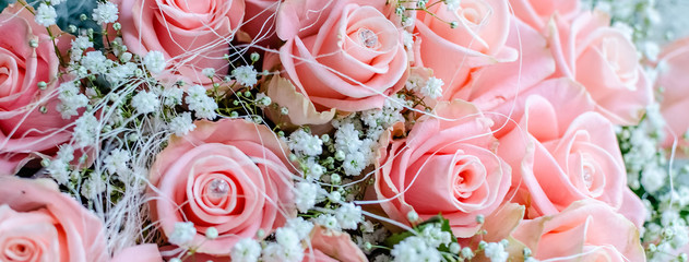 Bouquet of pink roses with small briliants