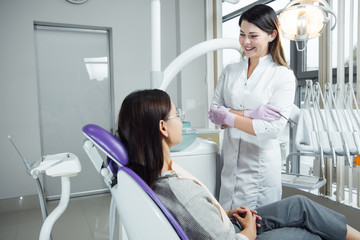 A woman is preparing for a dental examination. Woman having teeth examined at dentists. 