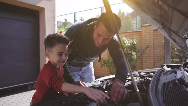 The father and son checking the car