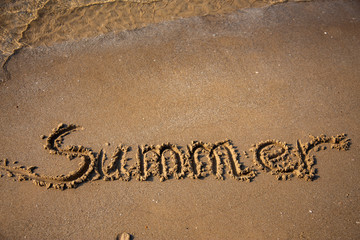 Fototapeta premium Sandy, sea shore, the waves are coming.